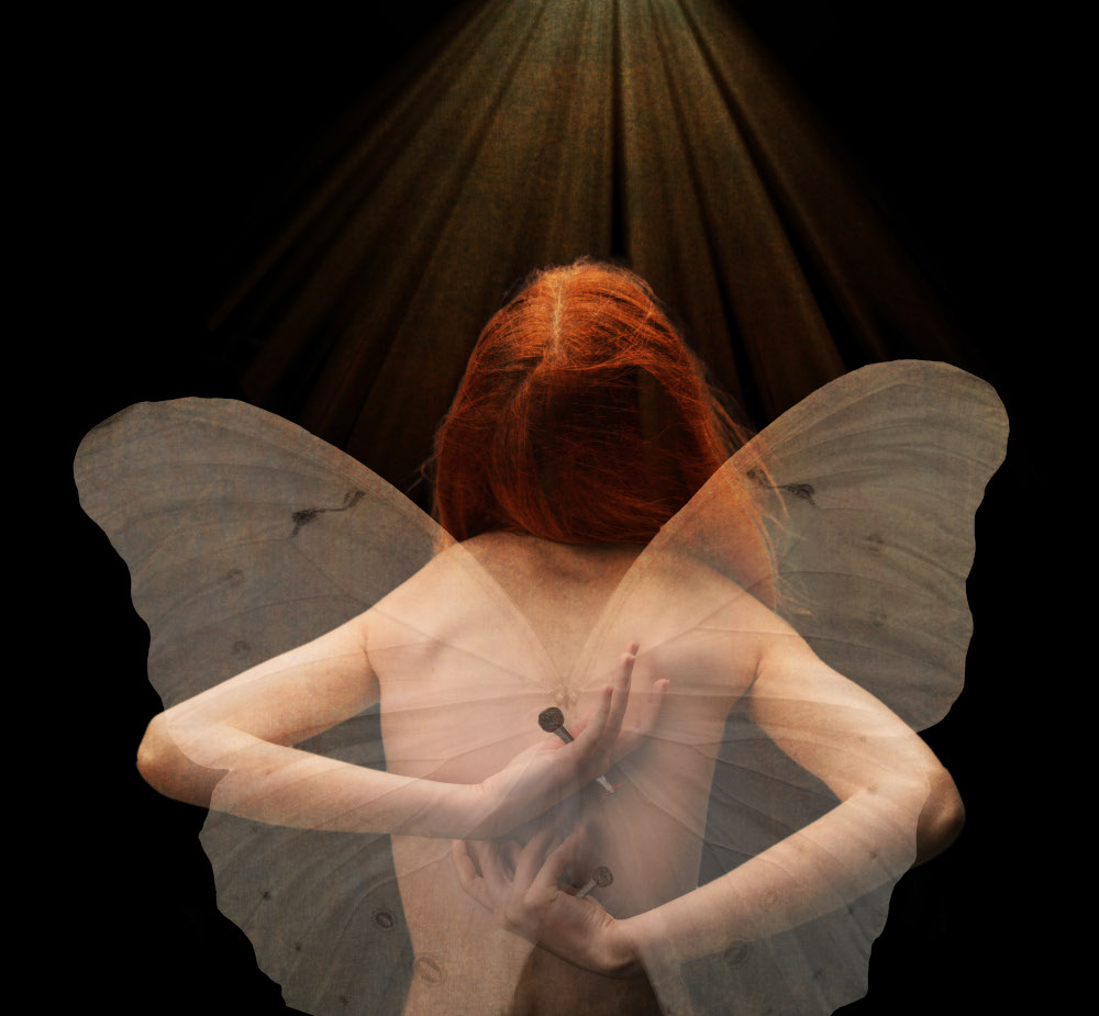 A woman with large, colorful wings extending from her back, holding a nail behind her back.